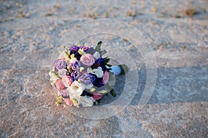 BrideÃ¢â¬â¢s wedding bouquet, flowers on White clay background photo